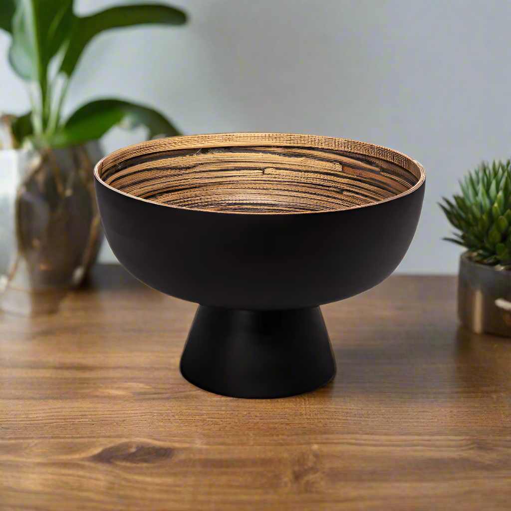 Black footed bowl with woven top on a white background