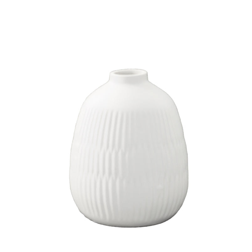 A matte finish white porcelain round vase with a geometric pattern design and a top wide entry.