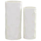 Two white ceramic vases of different heights on a white background