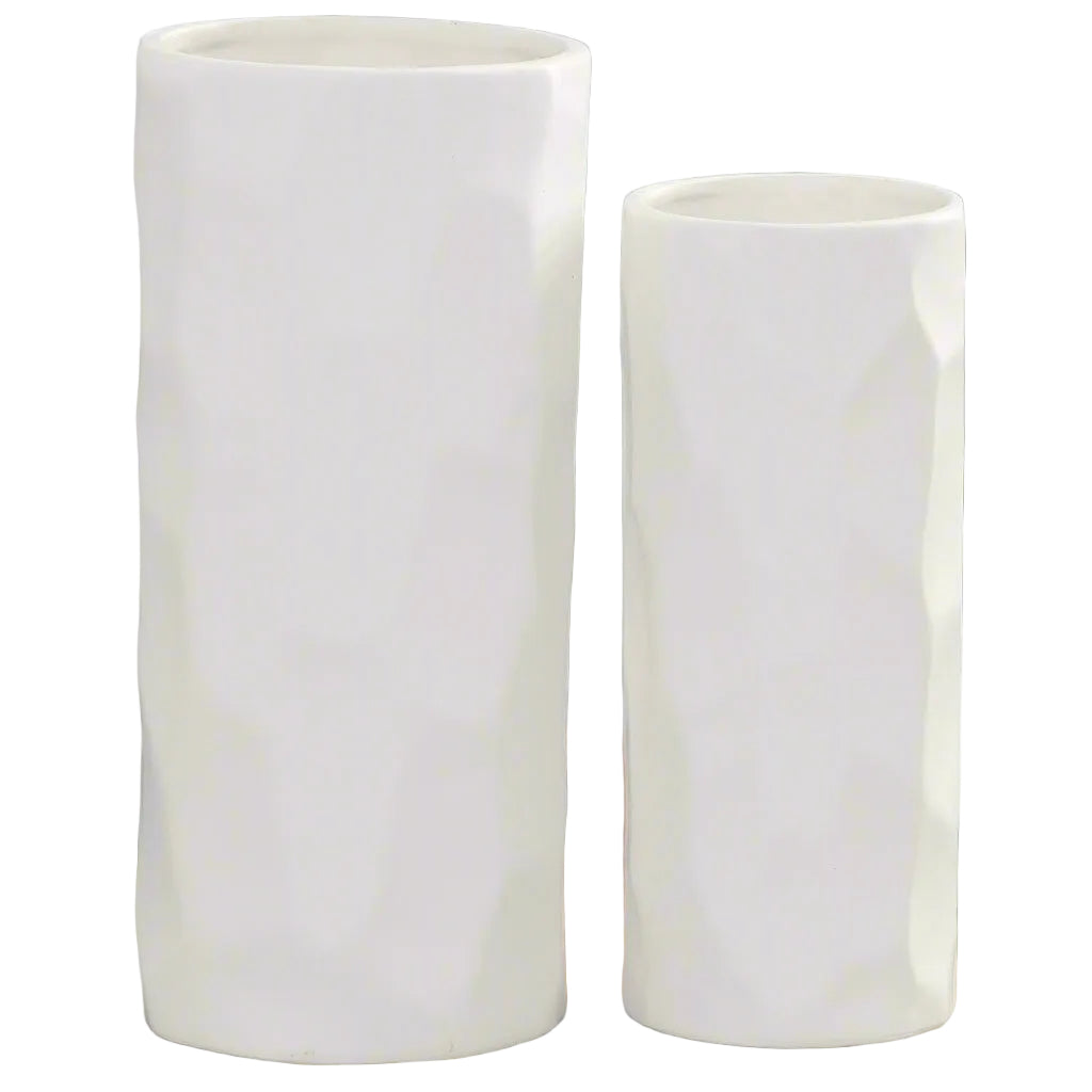 Two white ceramic vases of different heights on a white background