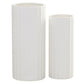 Two white textured vases on a white background