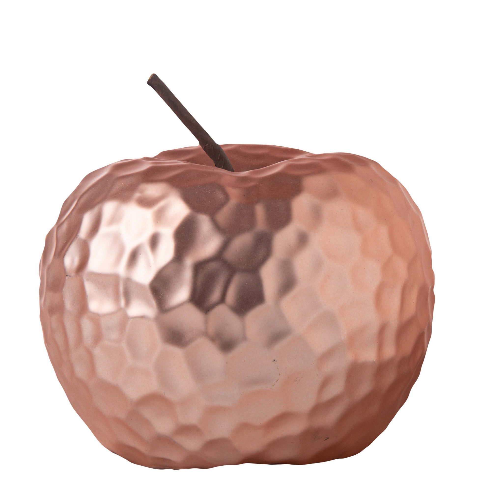 Copper apple with a textured surface on a white background