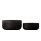 Two black woven bowls on a white background