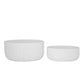Two white ceramic bowls of different sizes on a white background