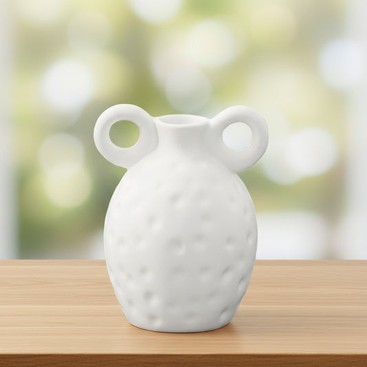 White ceramic vase with two handles on a white background