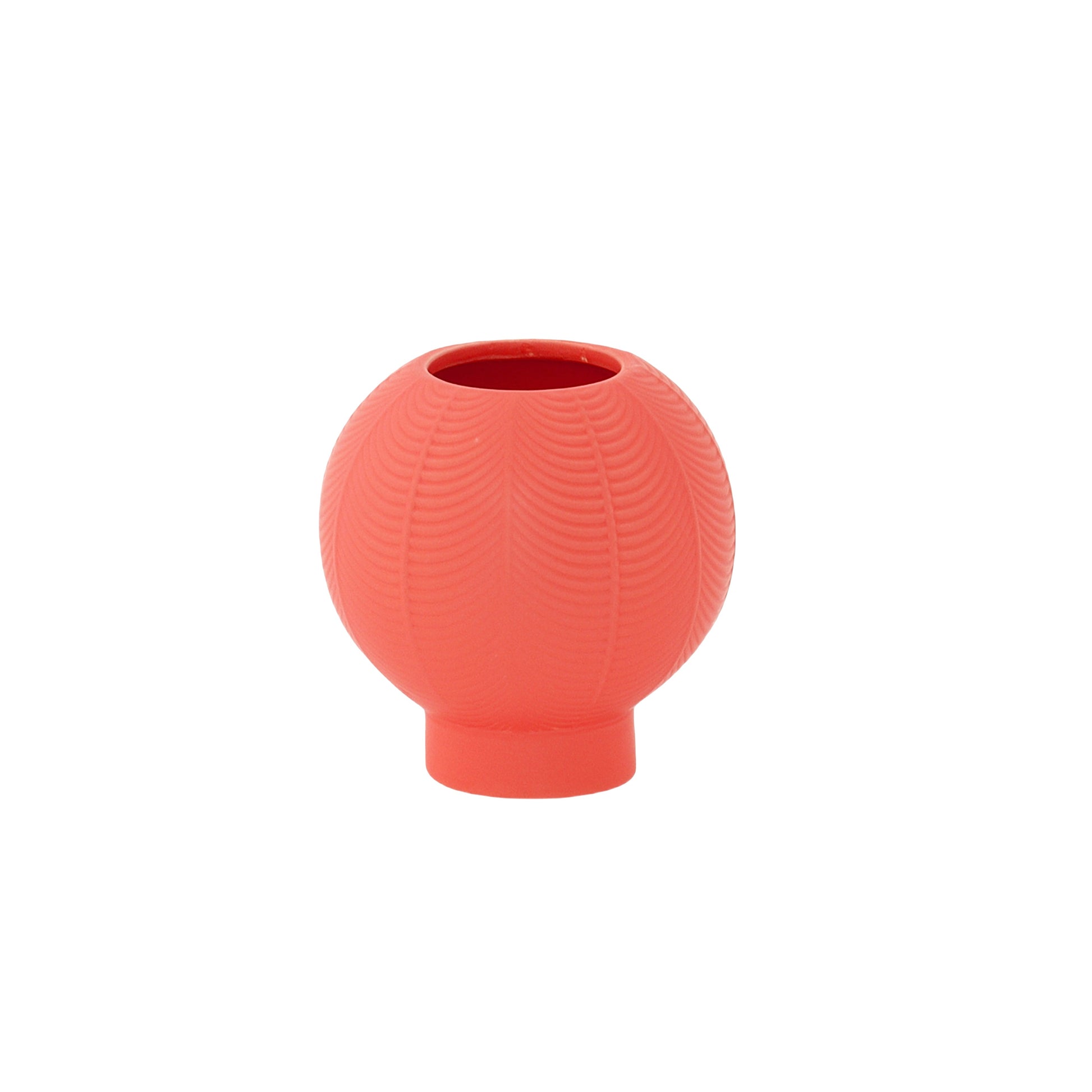 A matte white ceramic round vase with an embossed column and stripe design on the base.