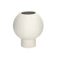 A matte white ceramic round vase with an embossed column and stripe design on the base.