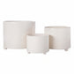 Three nested cylindrical ceramic planters in white with a subtle wavy textured pattern, displayed on a clean white background.
