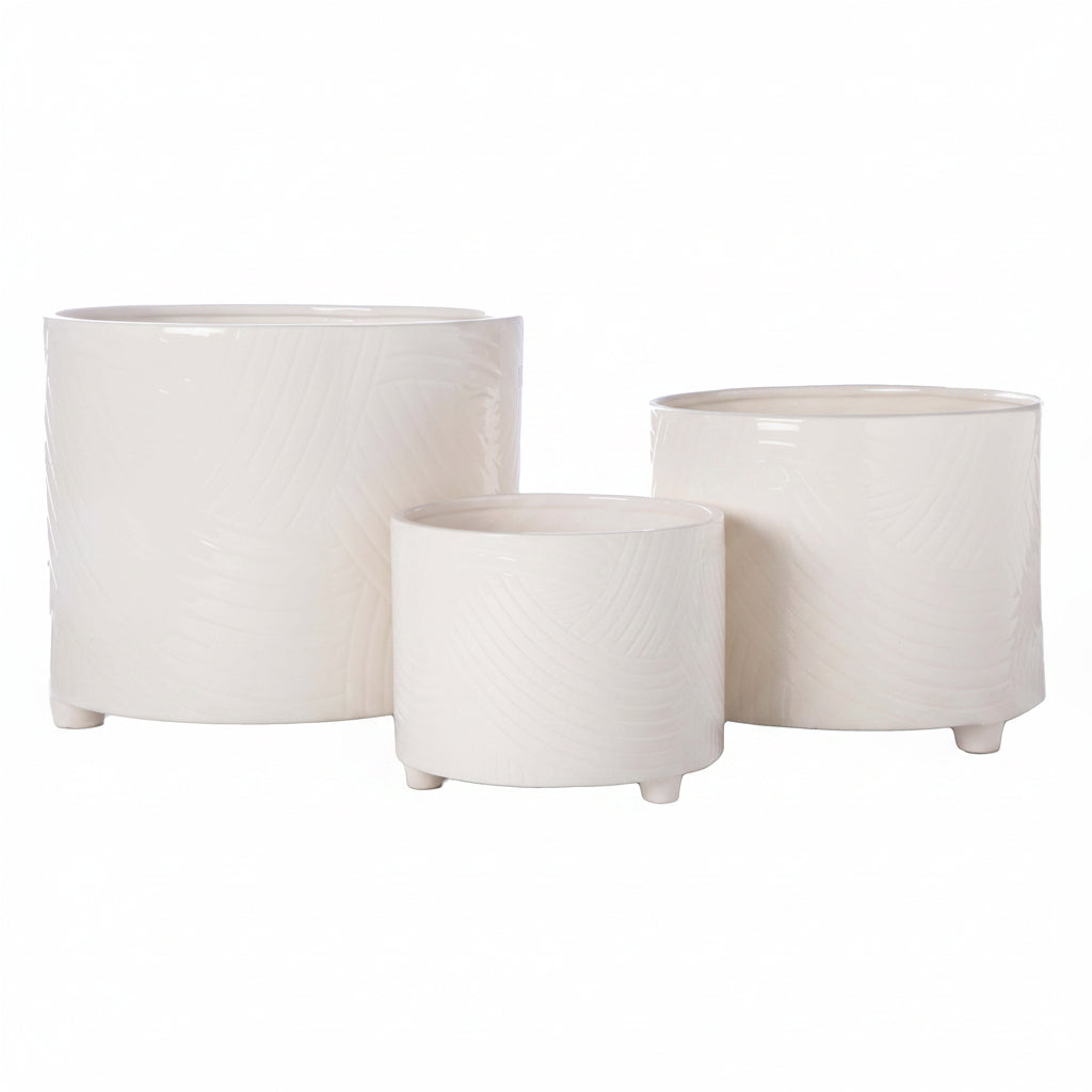 Three nested cylindrical ceramic planters in white with a subtle wavy textured pattern, displayed on a clean white background.
