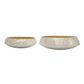 Two shallow round bowls with a textured, hammered silver-gray exterior and a smooth warm gold interior, displayed side-by-side on a light gray background.