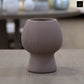 Zoryana Sculpted Stoneware Pot with Pedestal Base