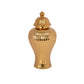 A gold ceramic urn vase with a ribbed design and a lid.