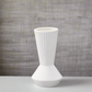 White textured vase on a neutral background