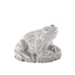 Decorative frog sculpture on a white background