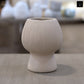 Zoryana Sculpted Stoneware Pot with Pedestal Base