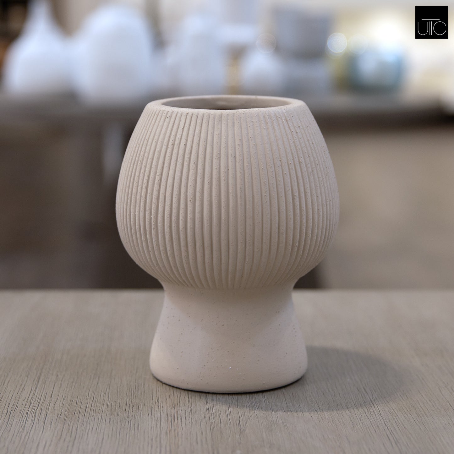 Zoryana Sculpted Stoneware Pot with Pedestal Base