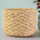 Woven basket on a light surface with a blurred background