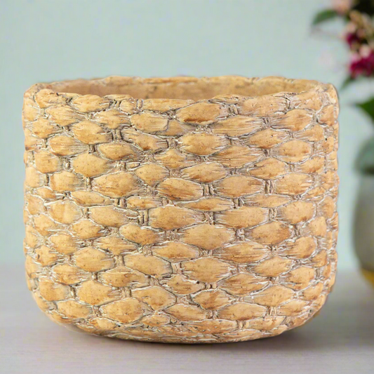 Woven basket on a light surface with a blurred background