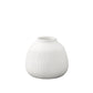A matte finish white porcelain round vase with a geometric pattern design and a top wide entry.