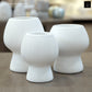 Zoryana Sculpted Stoneware Pot with Pedestal Base