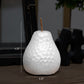 White ceramic pear-shaped candle with dimensions displayed
