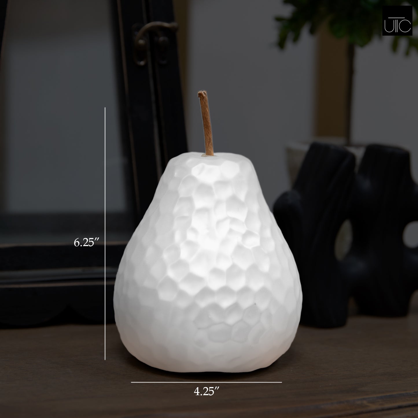 White ceramic pear-shaped candle with dimensions displayed
