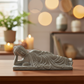 Jamarni Cement Side Lying Buddha Figurine with Hand on Head
