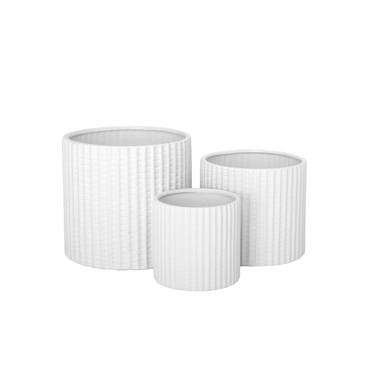 Set of three white ribbed planters on a white background