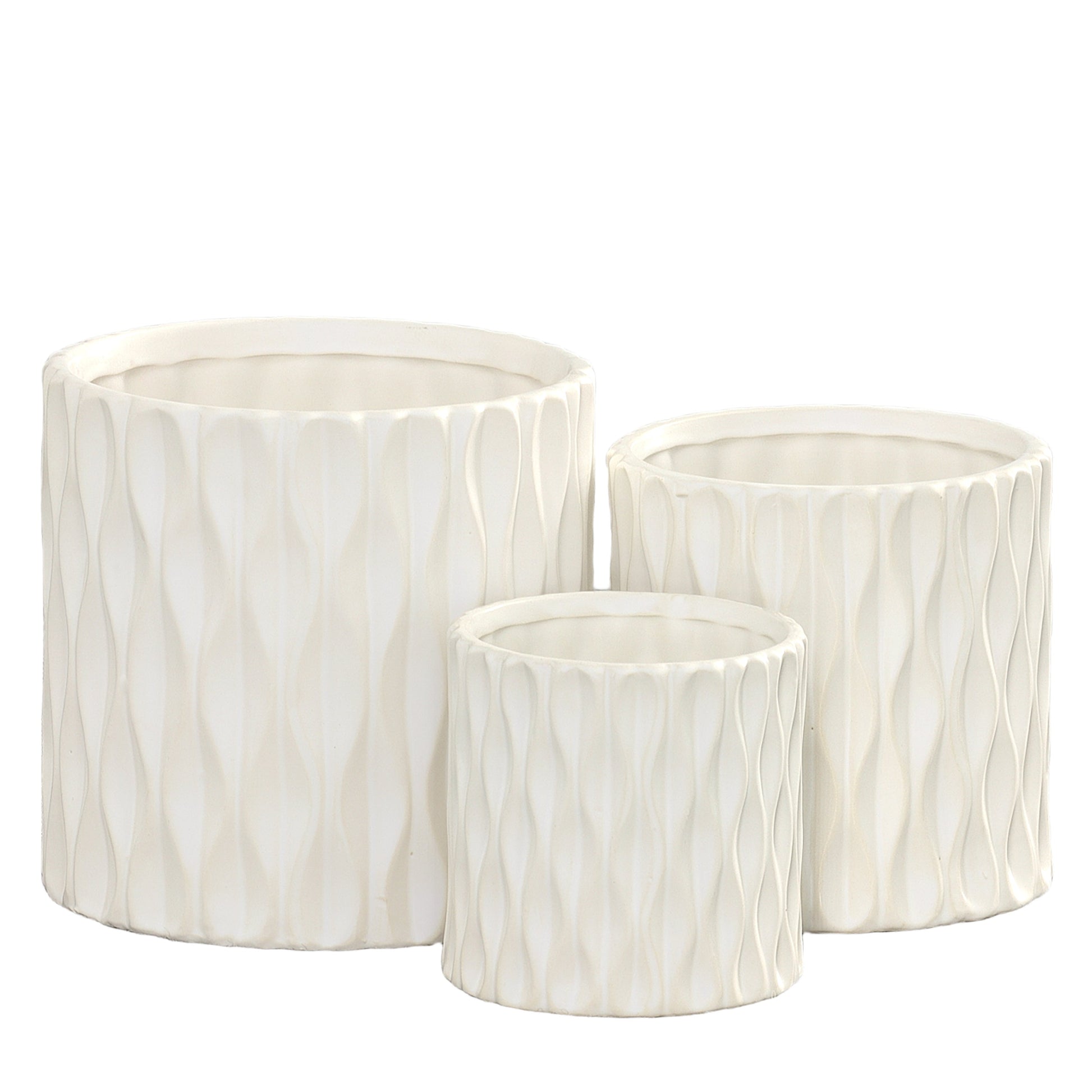 Set of three white ceramic cylindrical pots with embossed wave designs and matte finish.