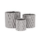 Set of three silver textured metal planters on a white background