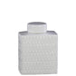 White textured ceramic jar with lid on a white background