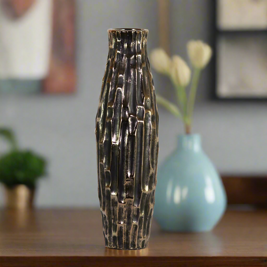 Decorative vase with textured surface on a table with a blurred background
