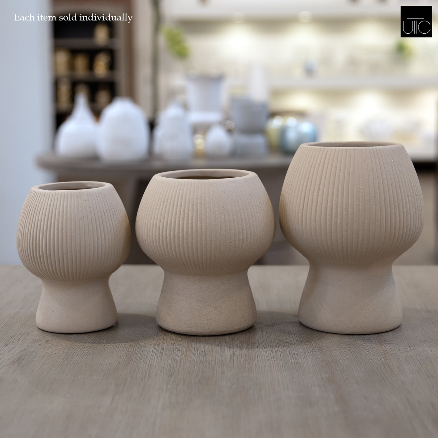 Zoryana Sculpted Stoneware Pot with Pedestal Base