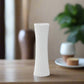 White textured vase on a white background