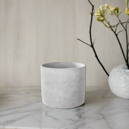 Gray concrete pot on a white background