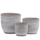 Three ceramic planters with striped patterns on a white background