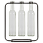Three clear glass bottles held in place by a black metal stand on a white background