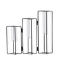 Set of three black metal and glass candle holders on a white background