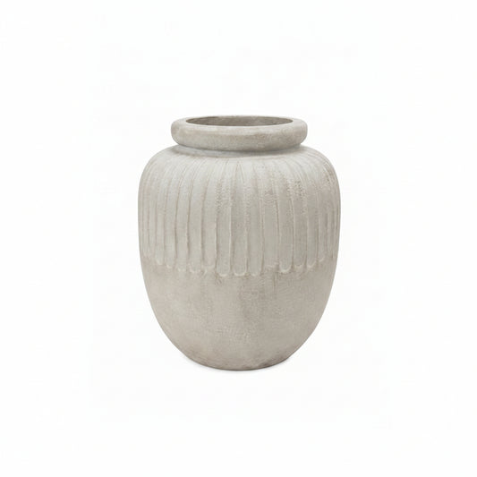 A light gray concrete planter pot with a ribbed vertical texture and a flared rim, shown on a solid white background.