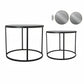 Two round black metal side tables with mirrored tops, part of a furniture set.