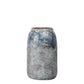 Ceramic vase with textured blue and gray design on a white background